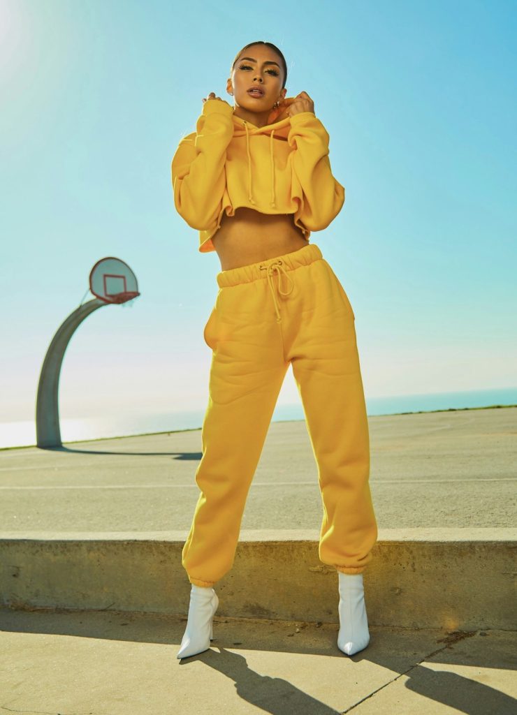Model in a yellow tracksuit on a basketball court