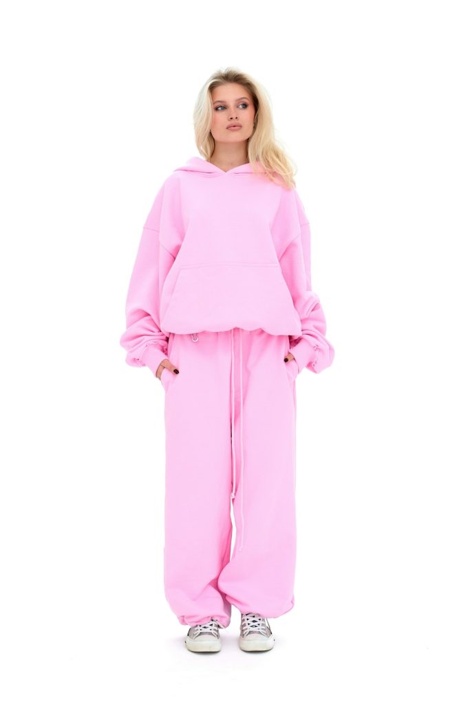 Model in an oversized hoodie and matching sweatpants